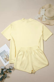 Yellow mock neck t-shirt and elastic waist shorts set with dropped shoulders.