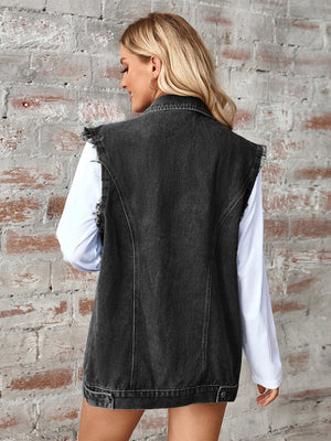 Black raw-edge denim utility vest with button closure and frayed shoulders.
