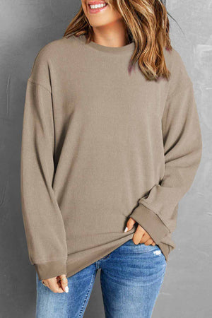 Textured ribbed crewneck pullover sweater in Khaki with long sleeves and crew neckline.