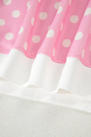 Pink polka dot top with white ribbed trim, polyester.