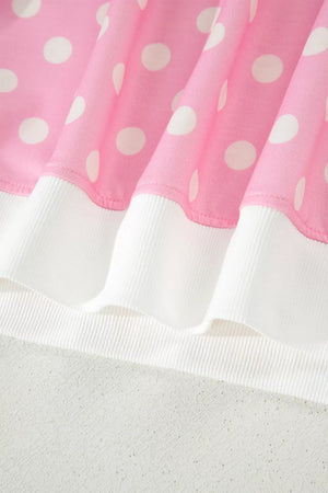 Pink polka dot top with white ribbed trim, polyester.