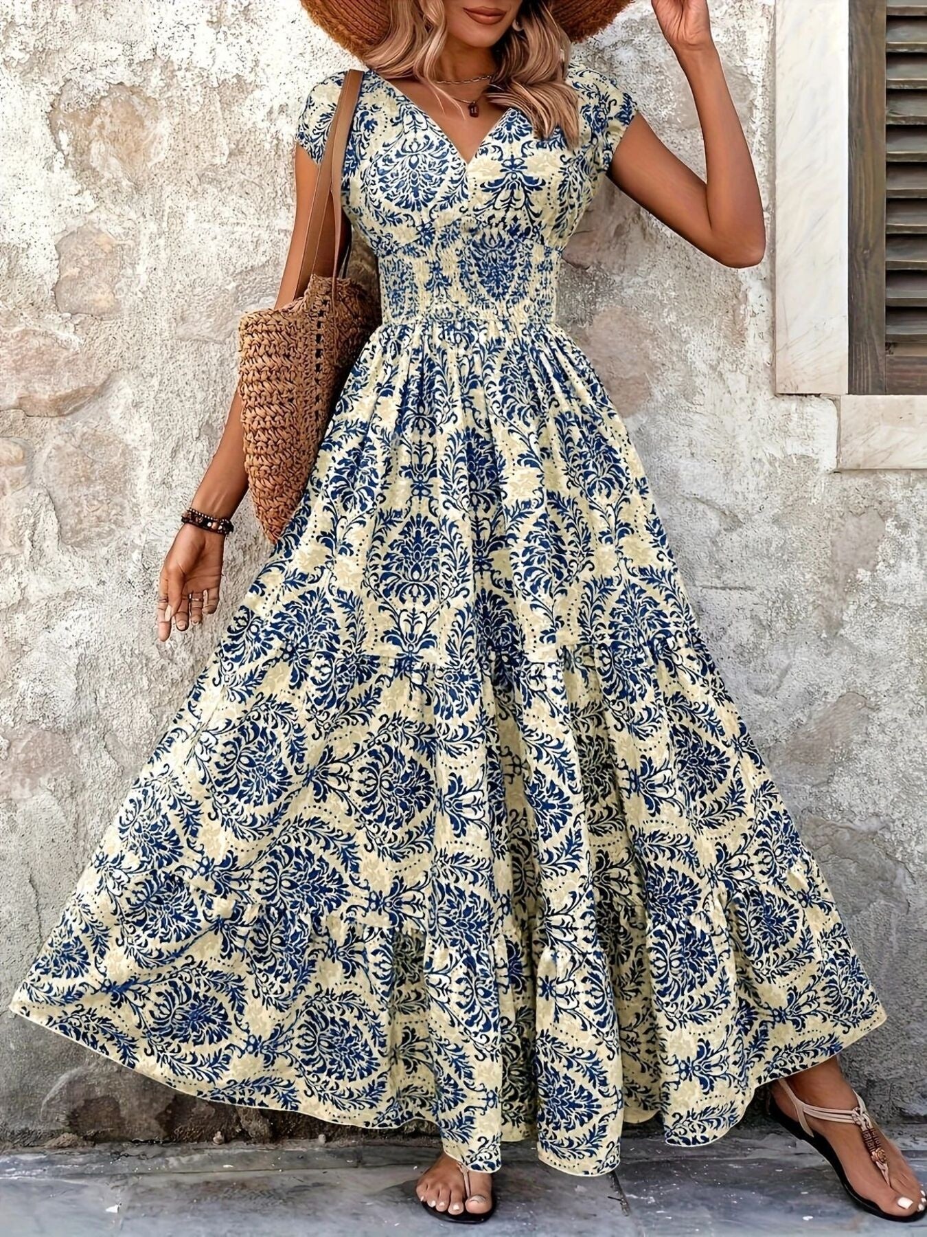 Blue flower damask print maxi dress with cap sleeves and smocked waist.
