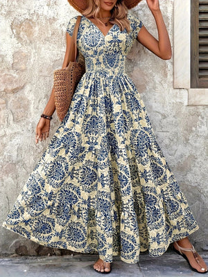 Blue flower damask print maxi dress with cap sleeves and smocked waist.