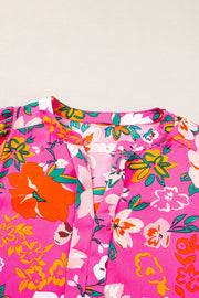 Hot Pink floral print tunic with gathered sleeves and V-neck.