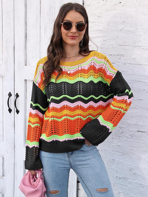 Crochet sweater with rainbow wave pattern, crew neck, and long sleeves.