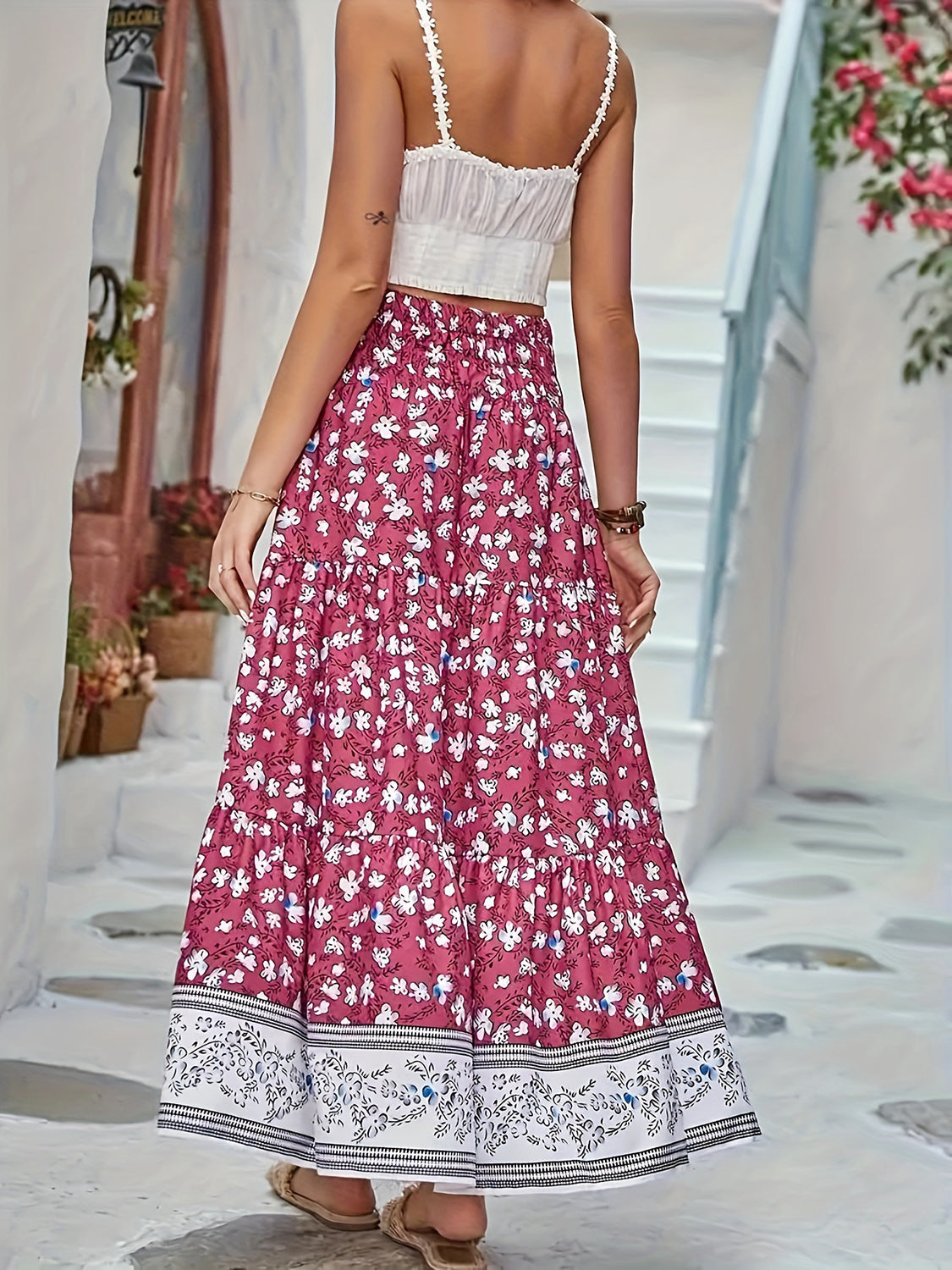 Maxi tiered skirt in cerise with a white floral print and border detail.