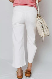 White relaxed fit ankle-length denim jeans with pearl embellishments on the side.