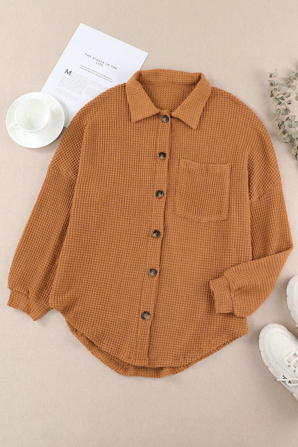 Caramel waffle knit button-down shirt jacket with a chest pocket and collared neckline.