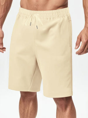 Apricot chino shorts with drawstring waist and side pockets.