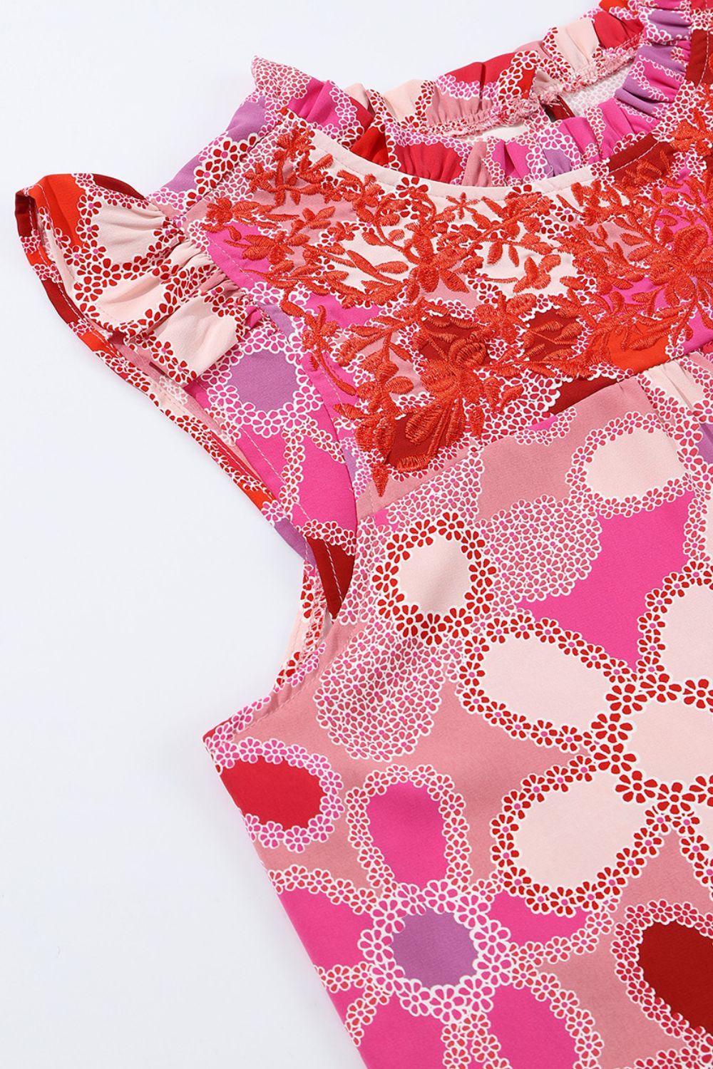 Floral embroidered yoke ruffle sleeve blouse in strawberry pink with a floral print.