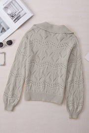 Gray openwork collar knit sweater with diamond pattern and ribbed cuffs.
