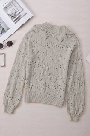 Gray openwork collar knit sweater with diamond pattern and ribbed cuffs.