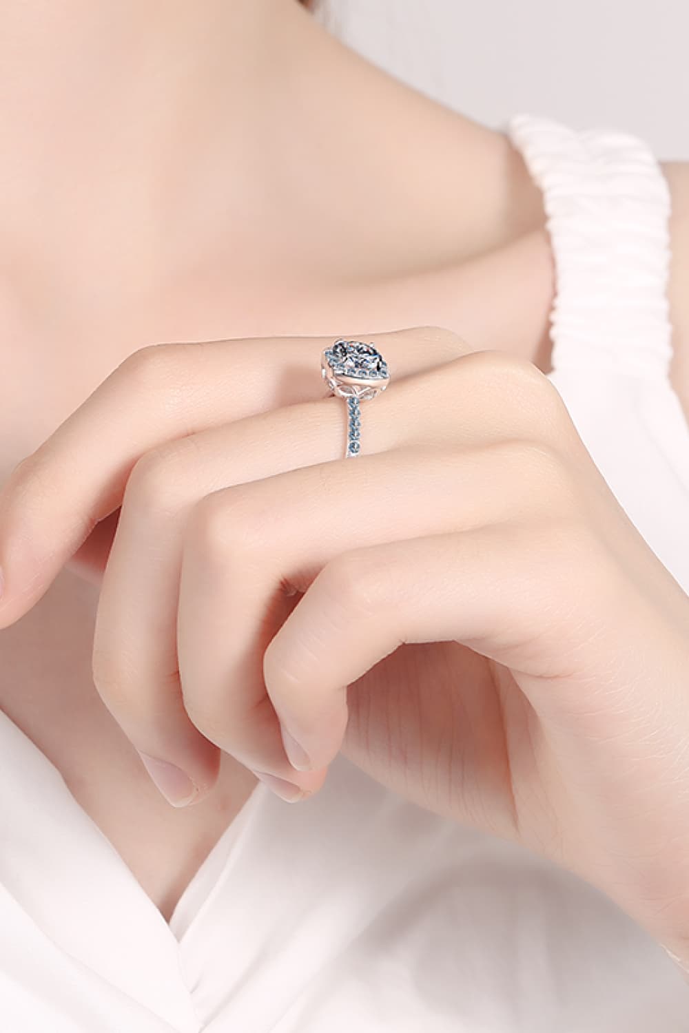Radiant Square Cut Halo Ring in silver sterling silver with sparkling accent stones.