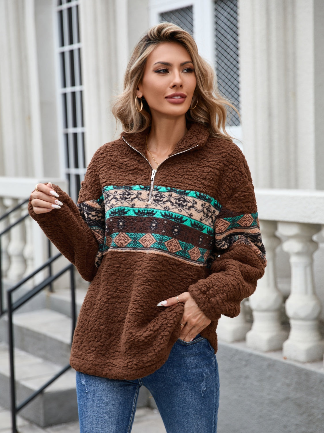 Brown sherpa quarter-zip pullover with Aztec trim and a relaxed fit.