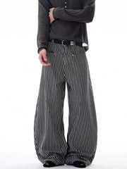 Men's black and white striped wide-leg sweatpants with a belt.