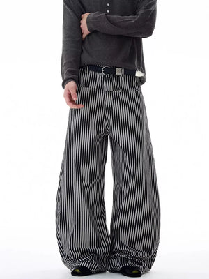 Men's black and white striped wide-leg sweatpants with a belt.