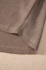 Luxe Notch Sleeve Blouse in taupe waffle knit fabric, showing hem detail