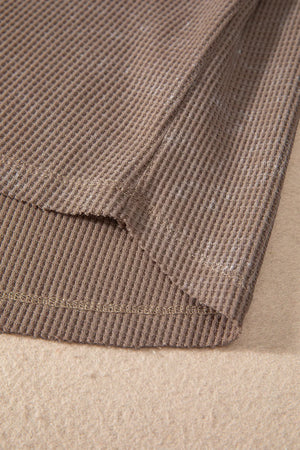 Luxe Notch Sleeve Blouse in taupe waffle knit fabric, showing hem detail