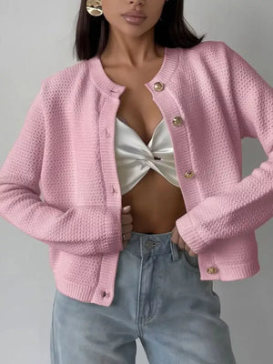 Blush pink textured knit cardigan with round neck, button detail and ribbed cuffs.