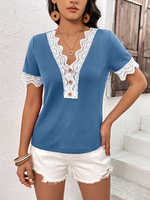 Cerulean waffle knit henley with lace trim and button detail.