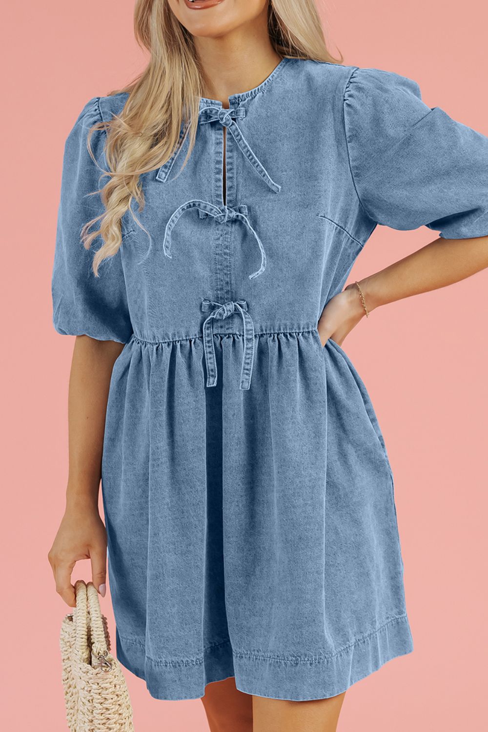 Prairie denim dress in medium with puff sleeves and tie details at the neckline and waist.