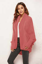 Cocoon knit cardigan in Rust with shawl collar and batwing sleeves.