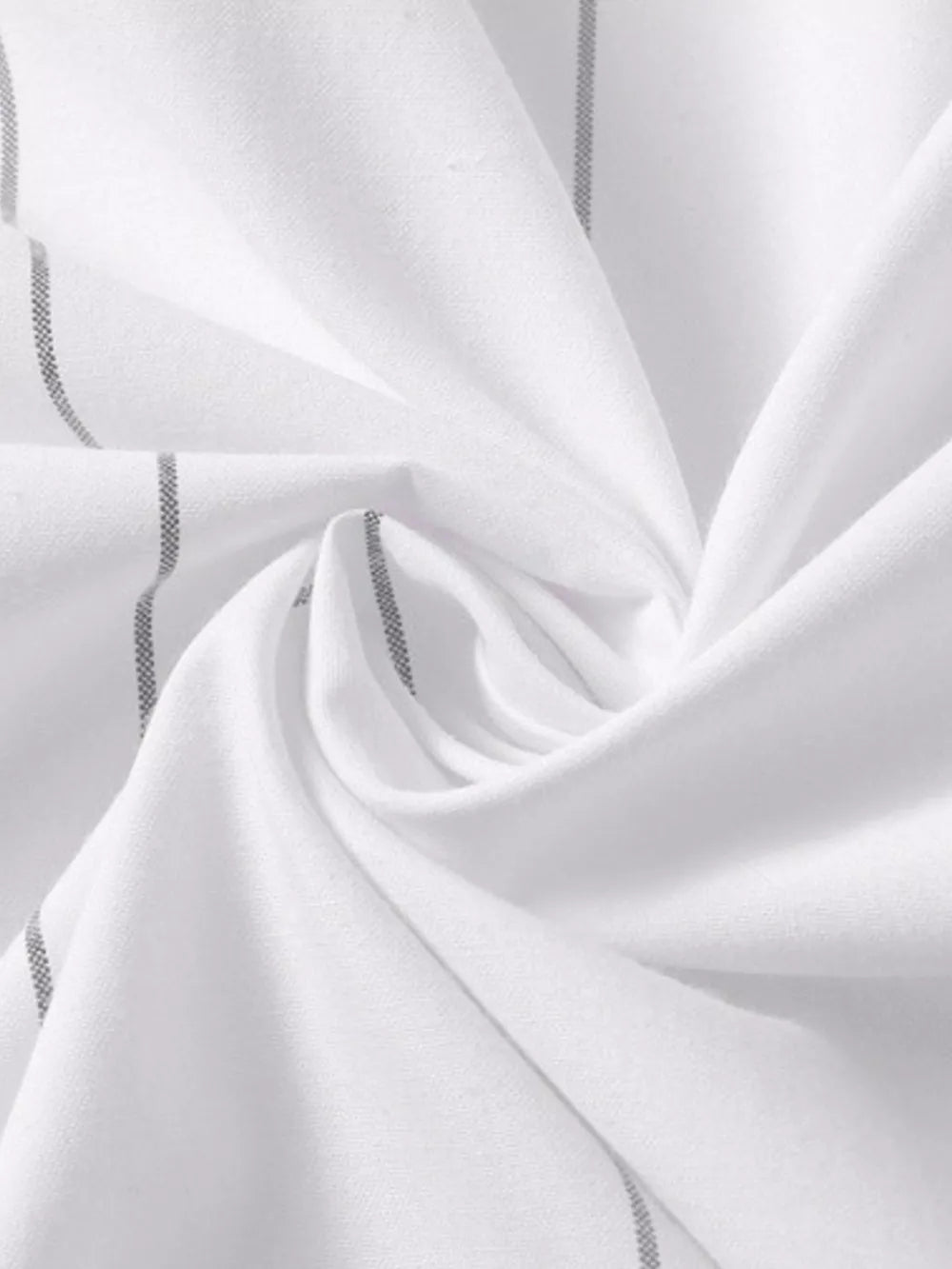 White cotton oversized button-down shirt with subtle grey pinstripes