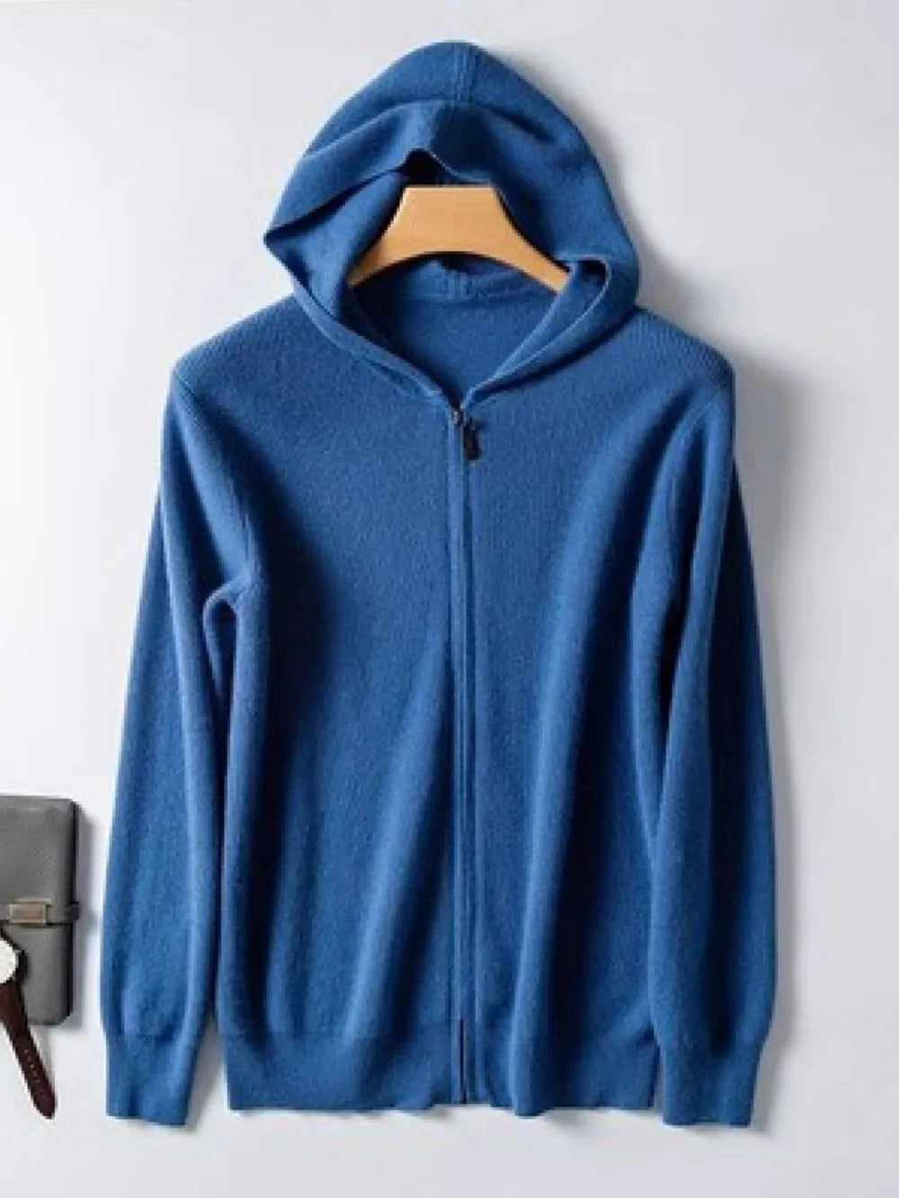 Peacock blue cashmere hooded zip-up sweater with a full zipper closure.