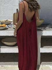 Burgundy backless maxi dress with spaghetti straps and drawstring detail.