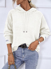 White textured knit raglan sleeve hoodie with drawstring hood and cuff detail.