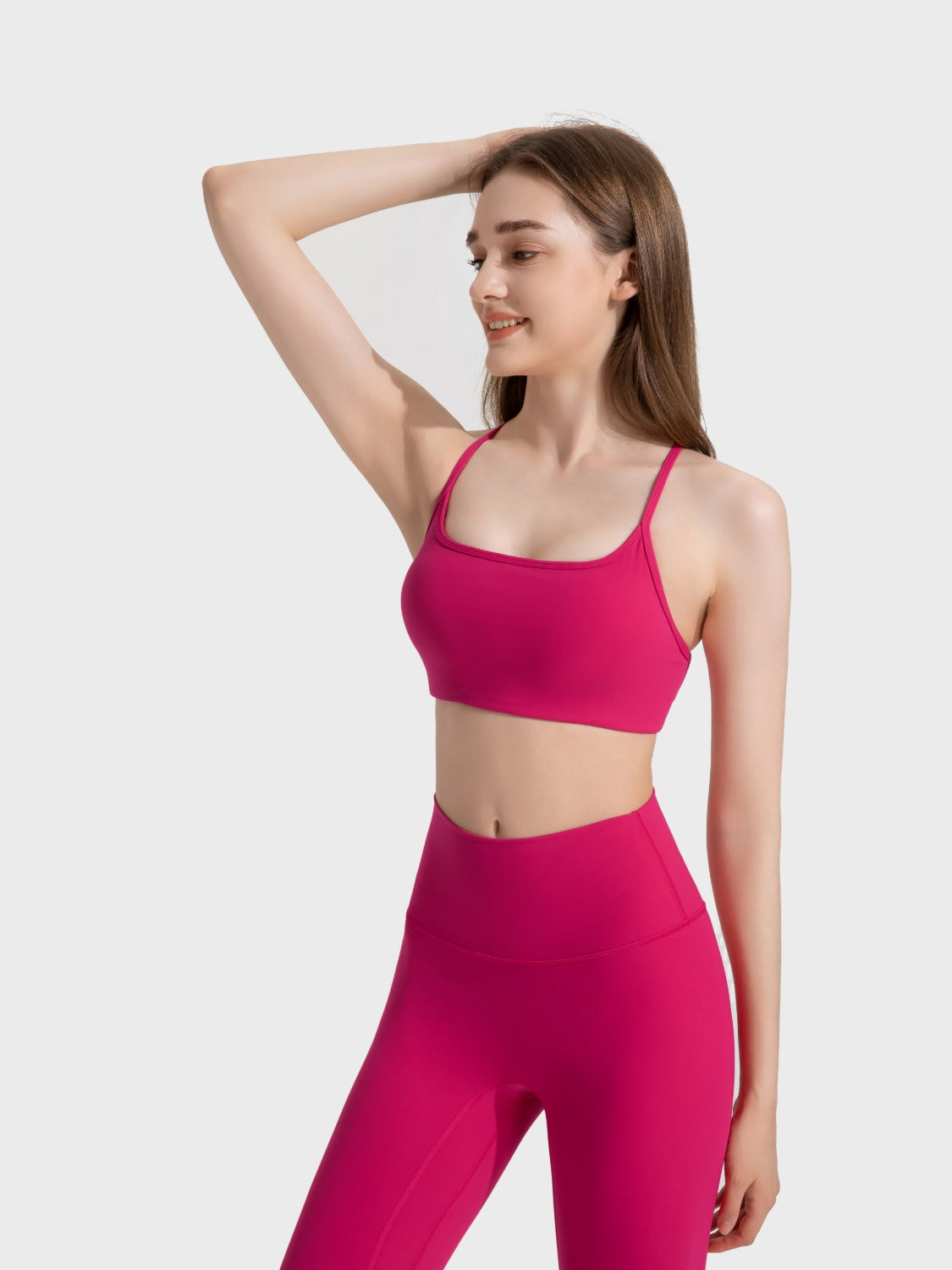 Strappy back active crop top in Fuchsia Pink with a square neckline.