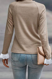 Khaki long sleeve top with lace cuffs and pleated yoke detail