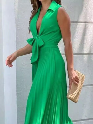 Green pleated maxi dress with tie-front and plunging neckline.