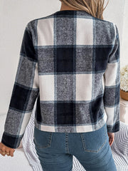 Collarless plaid cropped jacket in dark blue and white, with long sleeves.