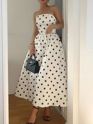 Charming cream polka dot strapless midi dress with A-line skirt.