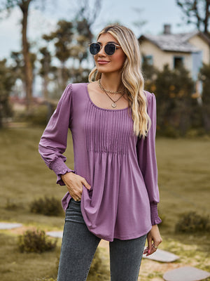 Dusty Purple blouse with gathered yoke, peplum sleeves, and smocked cuffs.