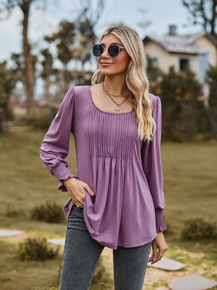 Dusty Purple blouse with gathered yoke, peplum sleeves, and smocked cuffs.