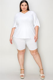 White relaxed fit tee with v-neck and short sleeves, paired with matching bike shorts.