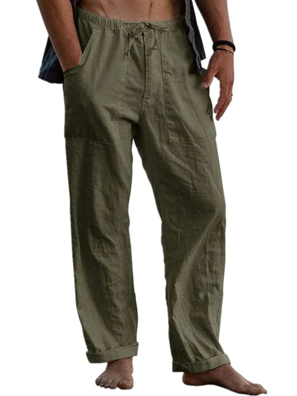 Full-size relaxed linen drawstring trousers in Gum Leaf with pockets and cuffed hems.