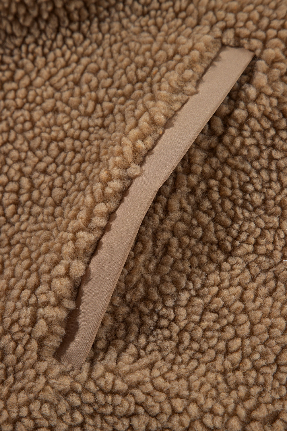 Brown sherpa jacket detail with contrast lining trim