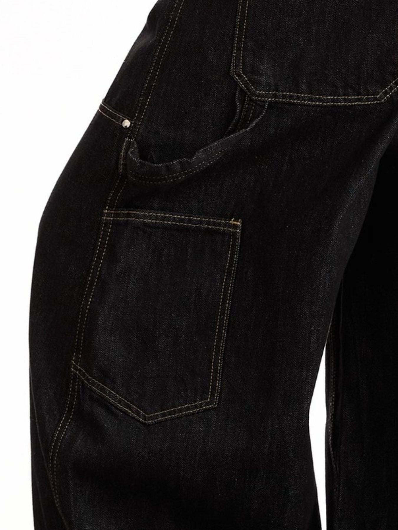Belted wide-leg black jeans with pockets and contrast stitching.