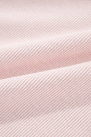 Blush pink corduroy shacket fabric with subtle texture and diagonal lines.