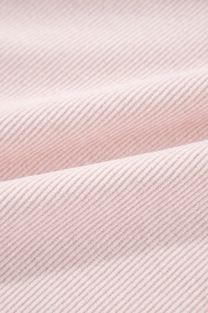 Blush pink corduroy shacket fabric with subtle texture and diagonal lines.