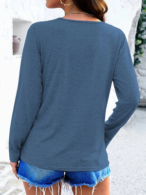 Royal blue long sleeve tee with textured fabric and a lattice neckline detail.