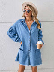Denim shirtdress in sky blue with voluminous sleeves, button front, pockets, and frayed hem.