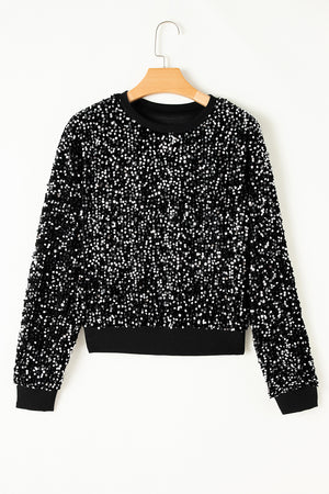 Black sequin embellished sweatshirt with ribbed cuffs and hem.