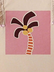 Baby tee with playful palm tree graphic on pink square, ruffle sleeve detail.