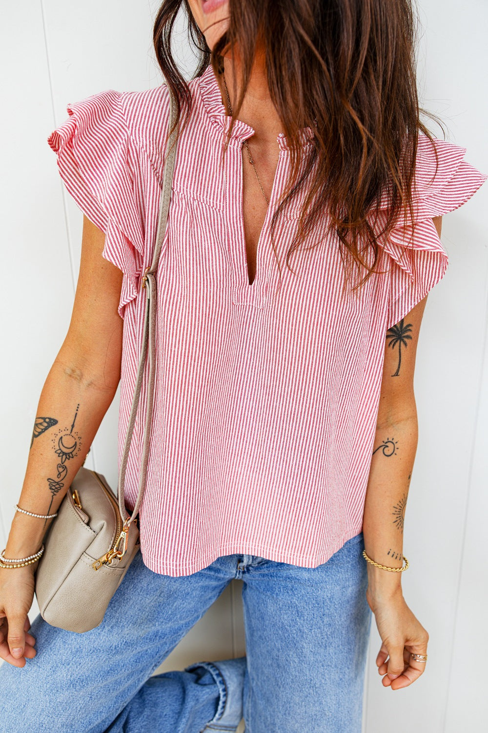 Red and white striped cotton blouse with ruffled short sleeves and a V-neck.