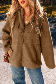 Brown sherpa hooded jacket with zip front and contrast lining detail.