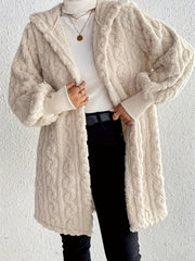 Beige hooded cocoon coat with textured cable knit, 100% polyester, open front.